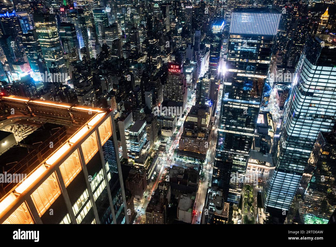 Aerial view of New York city at night with bright lights spakling in ...