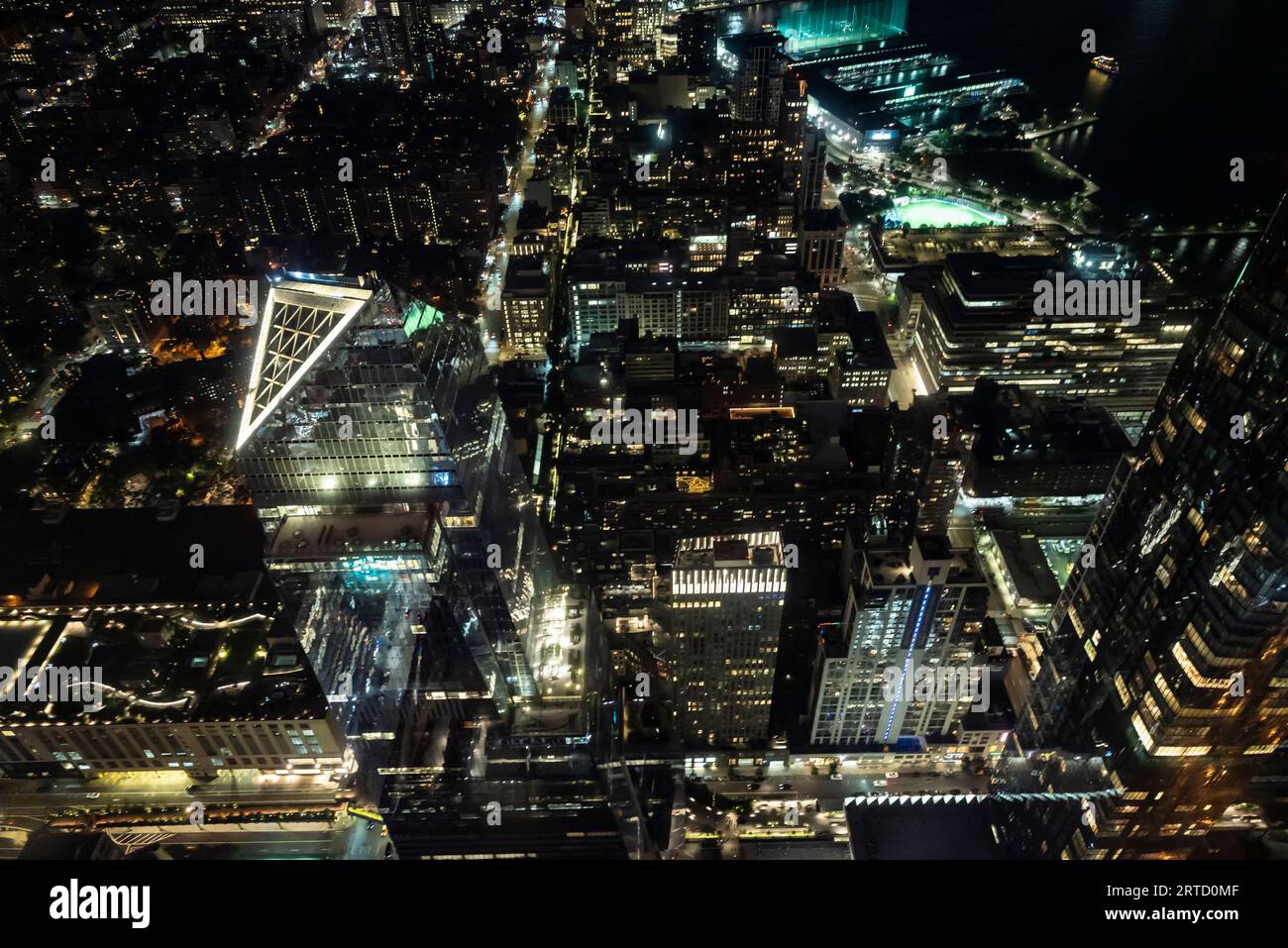 Aerial view of New York city at night with bright lights spakling in ...