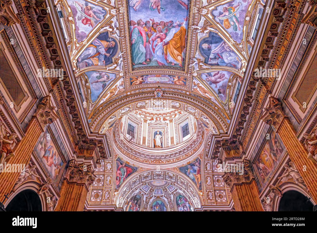 Interior of the baroque church of Santa Maria ai Monti in the historic center of Rome, Italy, built in 1603. The two domes and part of the fresco on t Stock Photo