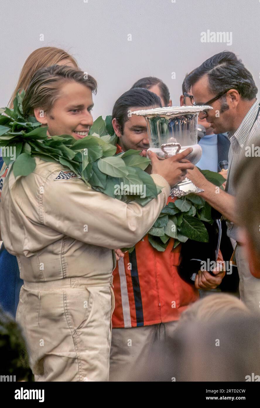 Leo Kinnunen and  Pedro Rodriguez with trophy for 1st place overall win in  the 1970 Watkins Glen 6 Hour race in a Porsche 917, started 3rd, finished 1st Stock Photo
