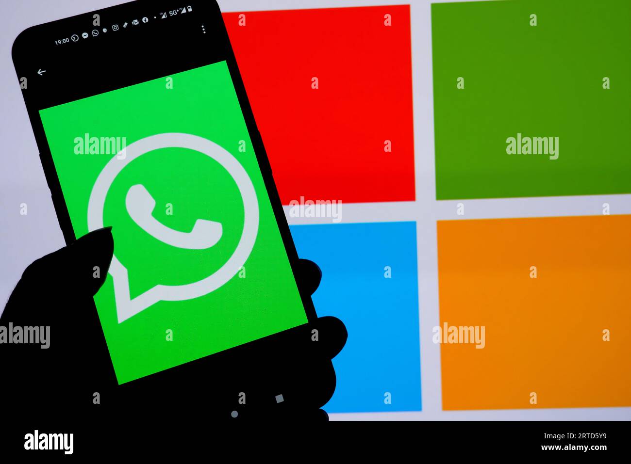 India. 10th Sep, 2023. In this photo illustration, A WhatsApp logo seen displayed on a smartphone with a Microsoft logo in the background. (Photo by Avishek Das/SOPA Images/Sipa USA) *** Strictly for editorial news purposes only *** Credit: Sipa USA/Alamy Live News Stock Photo