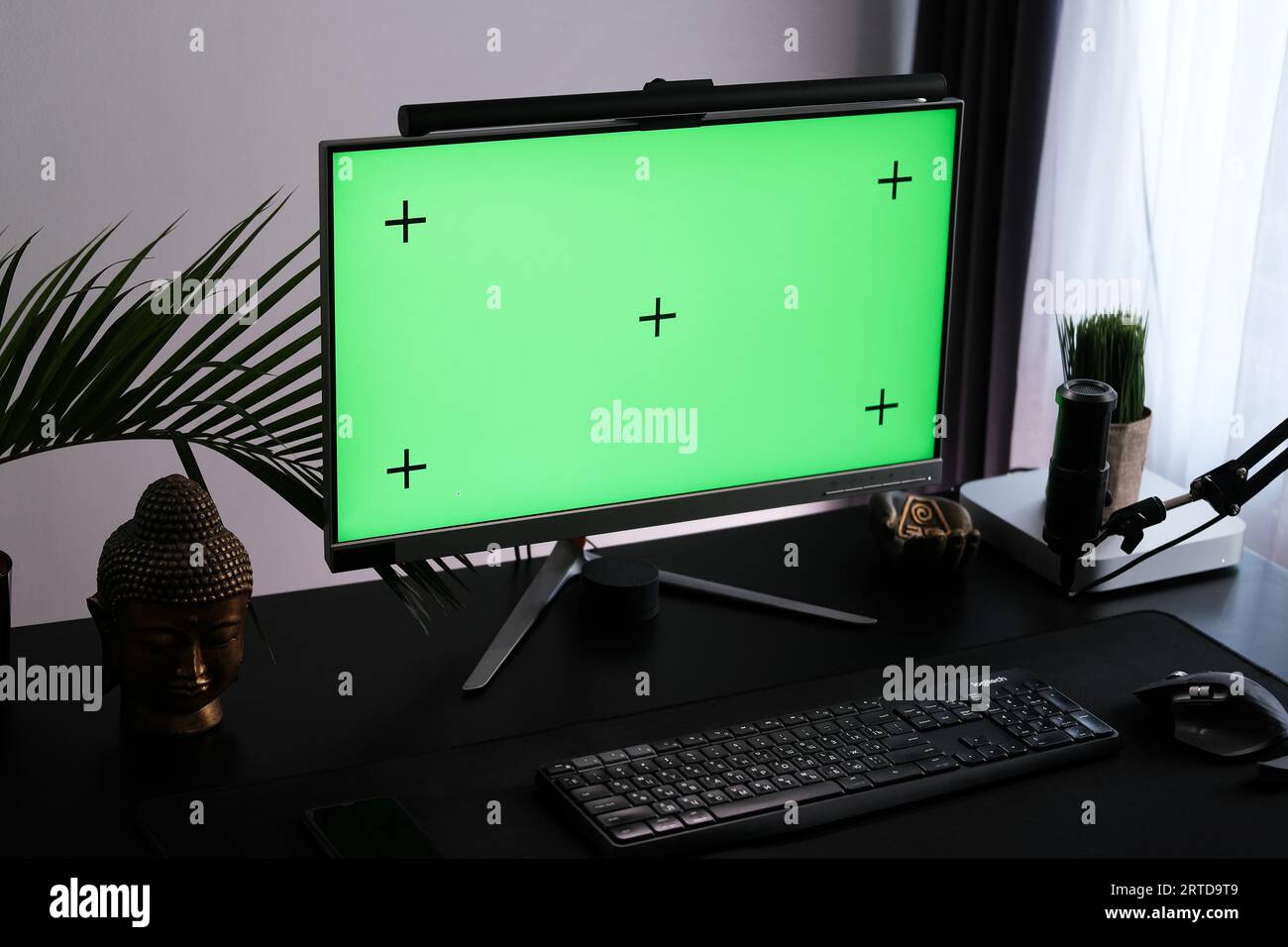 Green monitor screen in a interior. Workspace for podcasting and video blogging. Stock Photo