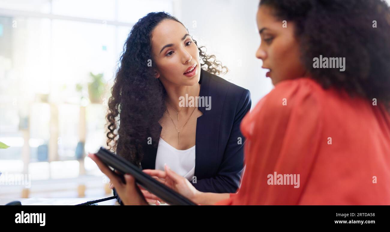 Teamwork, tablet and business women in office helping coworker with ...