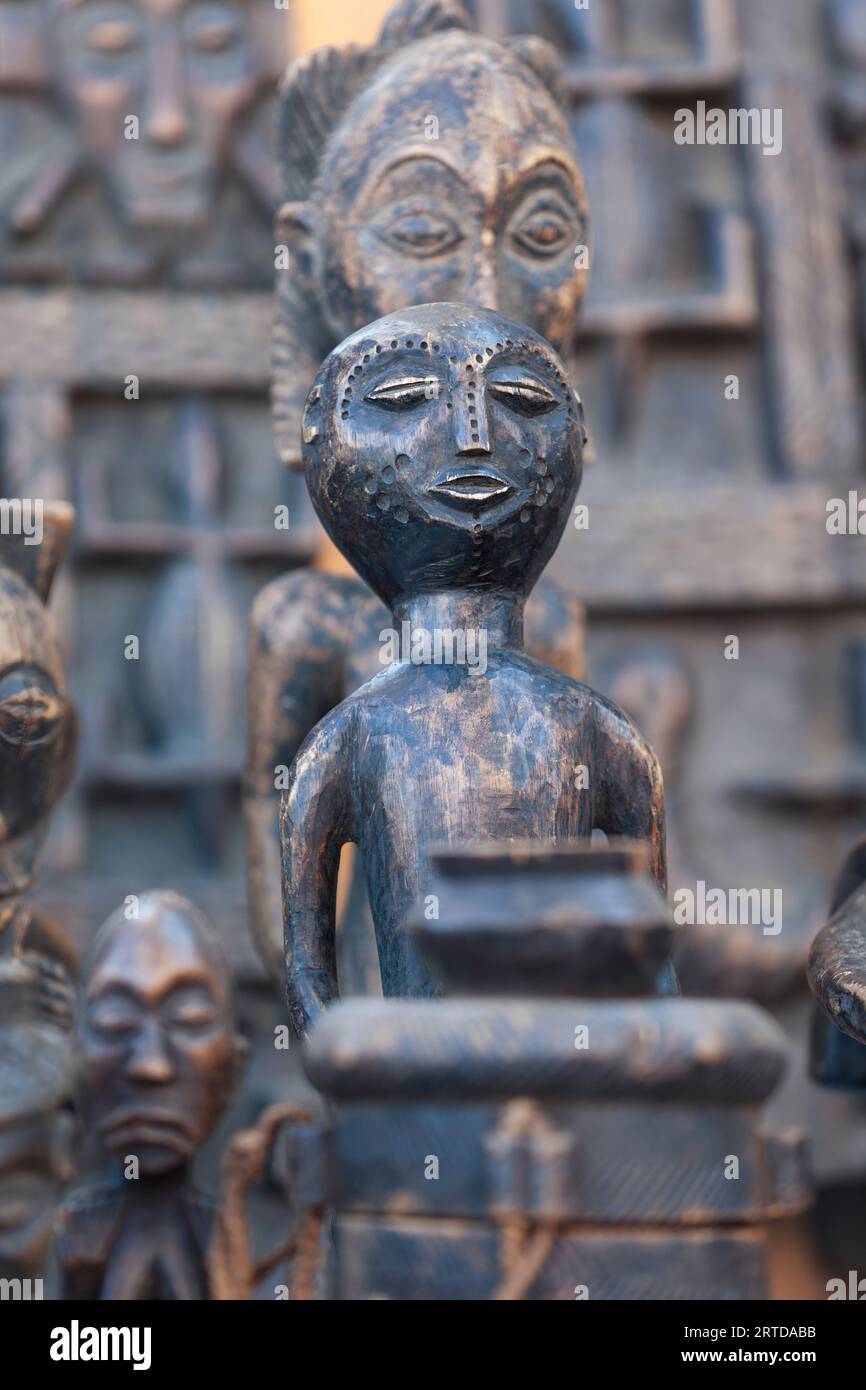 old african mask with a patina made out of wood, street vendor stall in Botswana Stock Photo