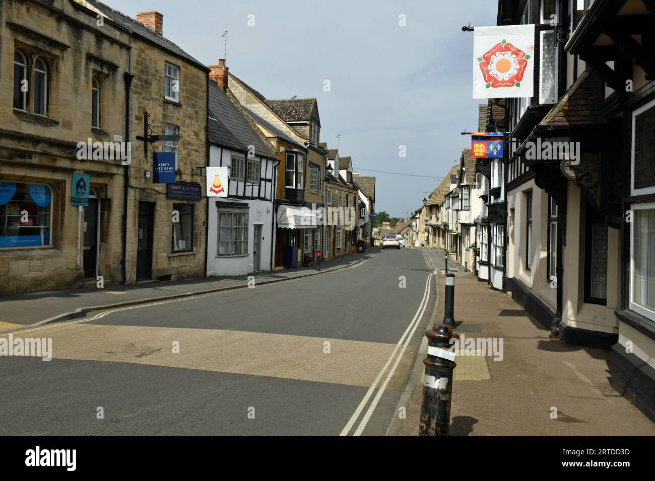 High Street in the Cotswolds WWith shops on either side.on a