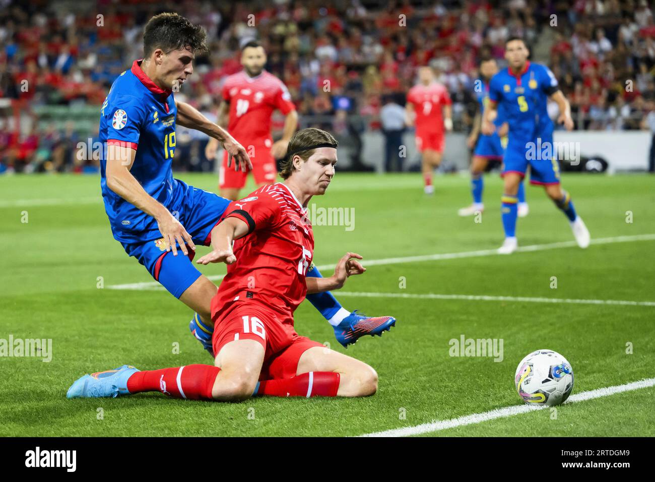 Andorra's Joel Guillen, left, fights for the ball with Switzerland's Cedric  Itten during the Euro 2024 qualifying group I soccer match between  Switzerland and Andorra at the Stade de Tourbillon stadium, in