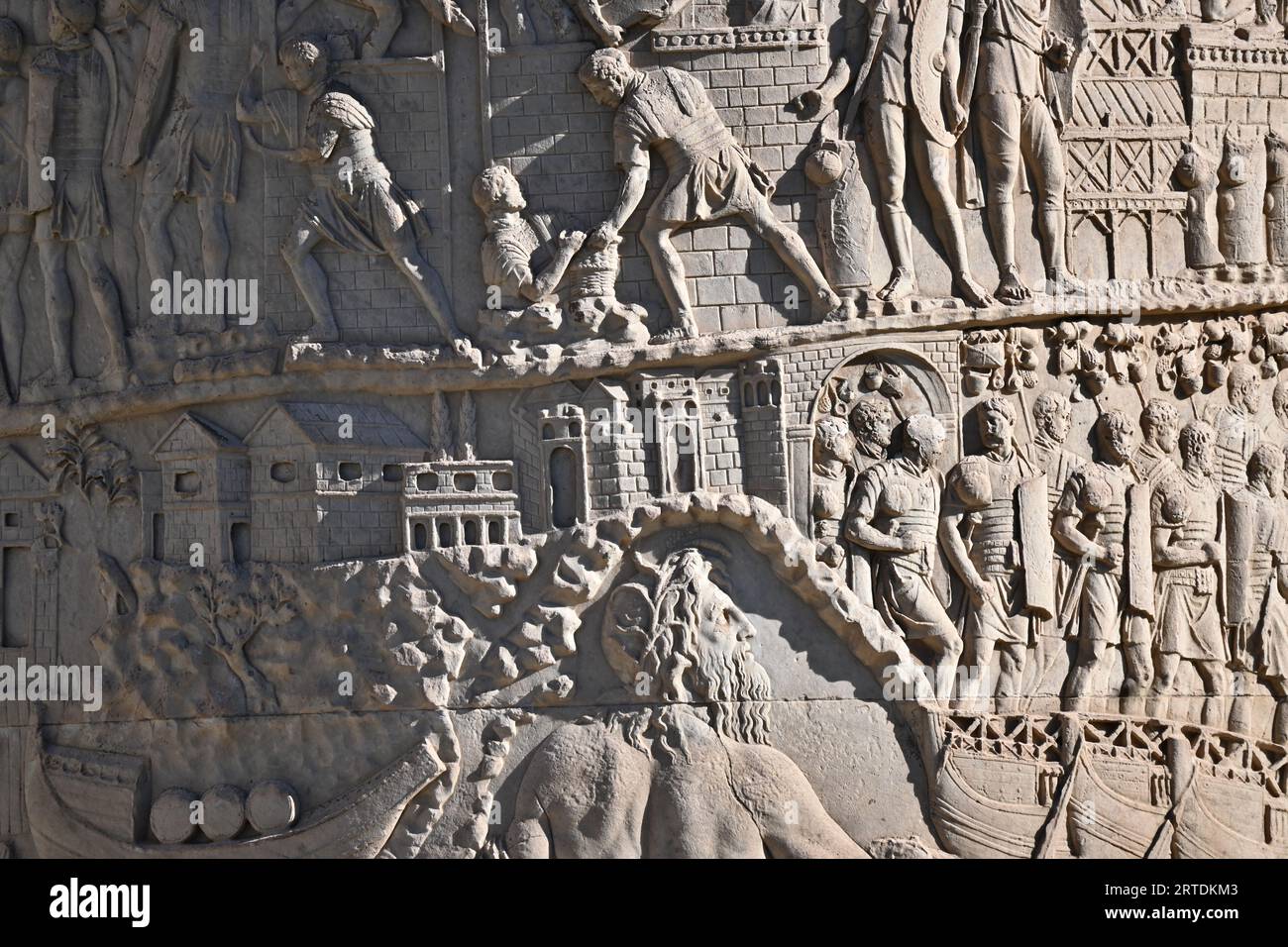 Trajan’s Column - Close up containing parts of Scene III (3) IV (4) XII (12) -  Rome, Italy. October 31 2022 Stock Photo