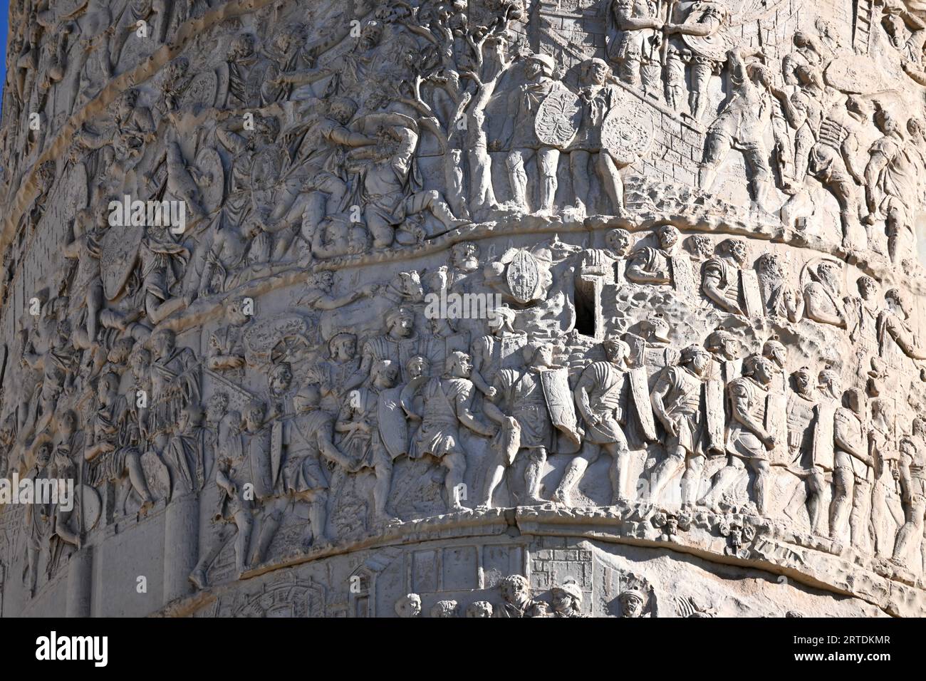 Trajan’s Column - Close up containing parts of Scenes CV (105) CVI (106) CXIII (113)-  Rome, Italy. October 31 2022 Stock Photo