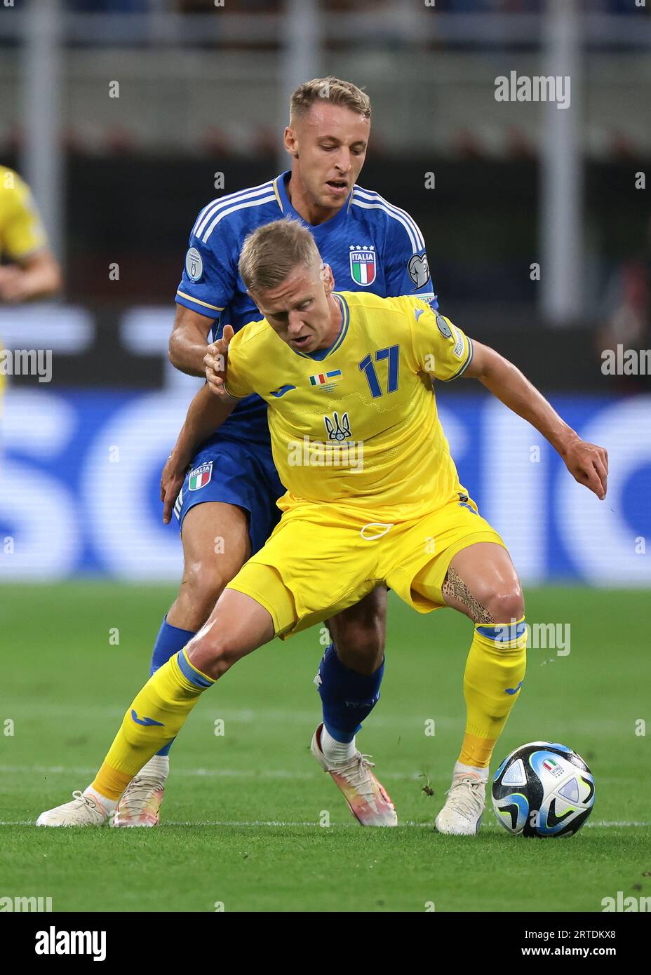 Milan, Italy. 12th Sep, 2023. Davide Frattesi of Italy tussles with Oleksandr Zinchenko of Ukraine during the UEFA EURO 2024 match at Stadio Giuseppe Meazza, Milan. Picture credit should read: Jonathan Moscrop/Sportimage Credit: Sportimage Ltd/Alamy Live News Stock Photo