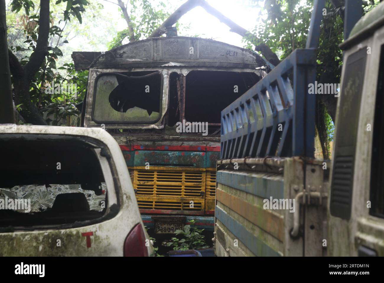 Dhaka, Bangladesh – September 12, 2023: Impounded vehicles have been left to rot under the open sky at Shahbagh Police Station’s dumping ground at Suh Stock Photo