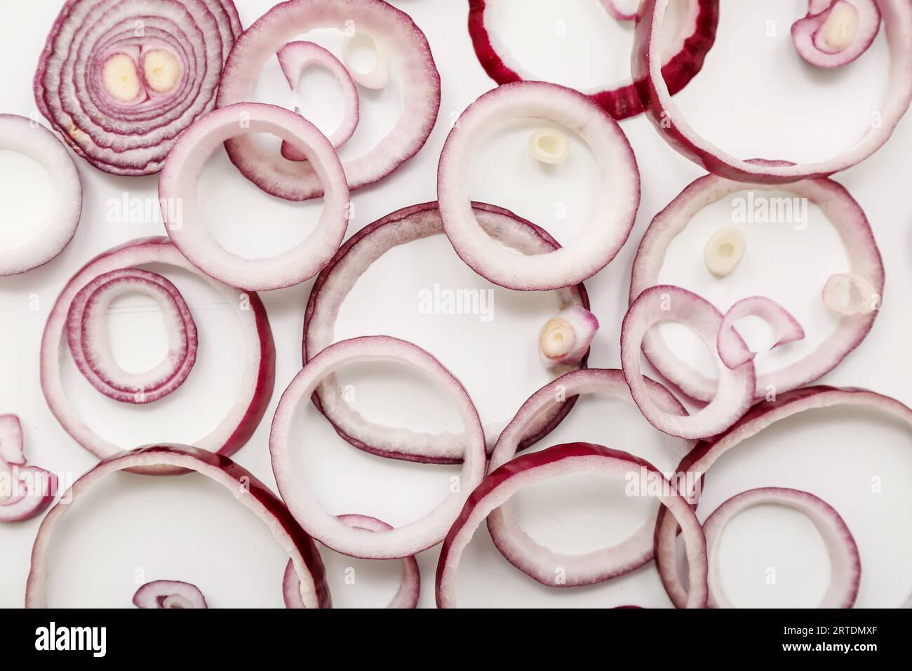 Slices of fresh red onion on white background Stock Photo - Alamy