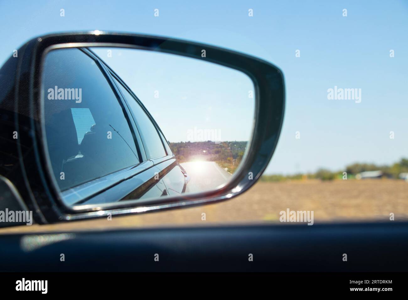 Closeup Rearview Mirror Car At Full Speed At Night In Big Modern