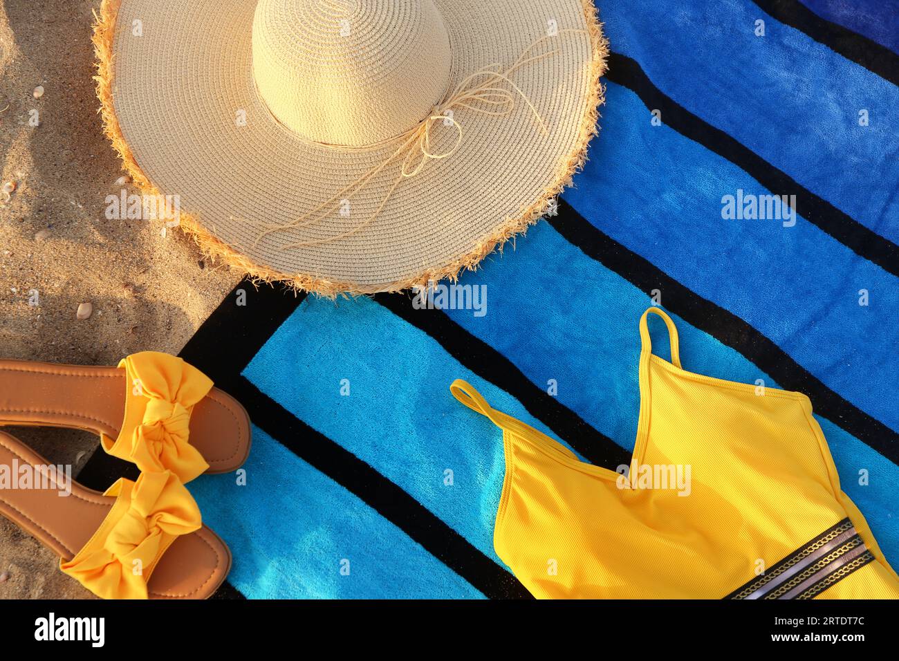 Composition with stylish beach accessories on sand Stock Photo
