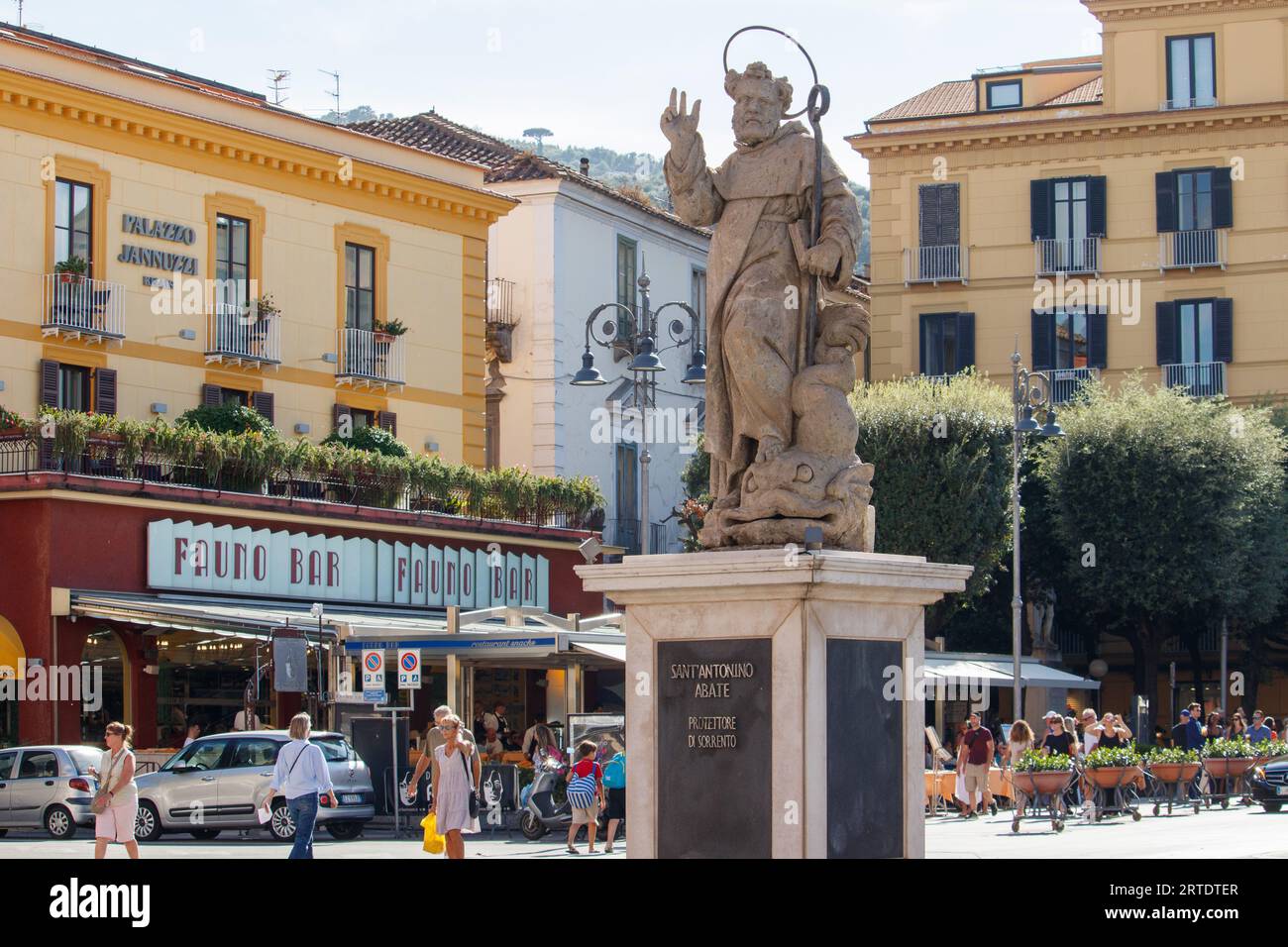 The statue of Sant' Antonino situated, Piazza Tassoin Square, Sorrento. Sorrento is a coastal town in southwestern Italy, facing the Bay of Naples on the Sorrentine Peninsula. Perched atop cliffs that separate the town from its busy marinas, it’s known for sweeping water views and Piazza Tasso, a cafe-lined square. Stock Photo