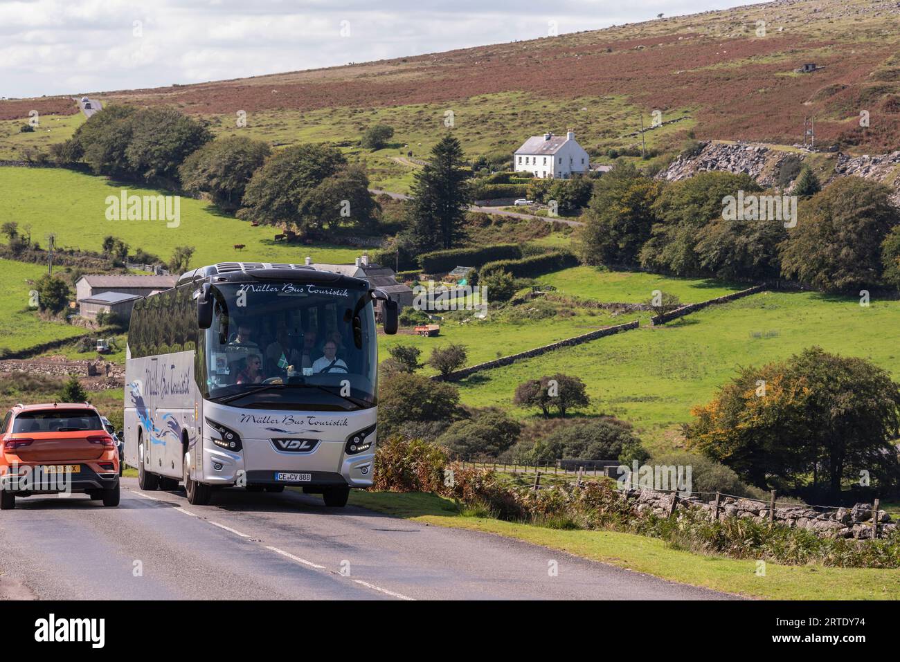 Dartmoor national park, Devon, England, UK. 4th September 2023. German tour bus travelling in Dartmoor national park, Devon, England, UK. Stock Photo