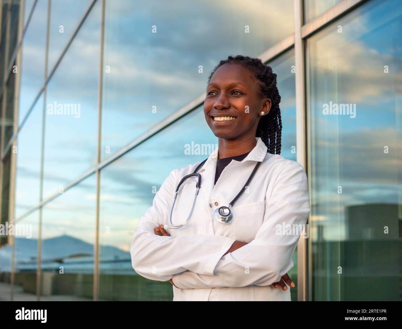 Black female doctor with arms crossed hi-res stock photography and ...