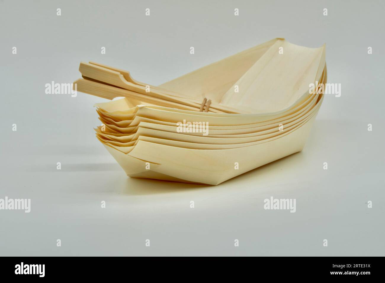 Environmentally friendly disposable Wooden Serving Boats with Wooden food picks Stock Photo