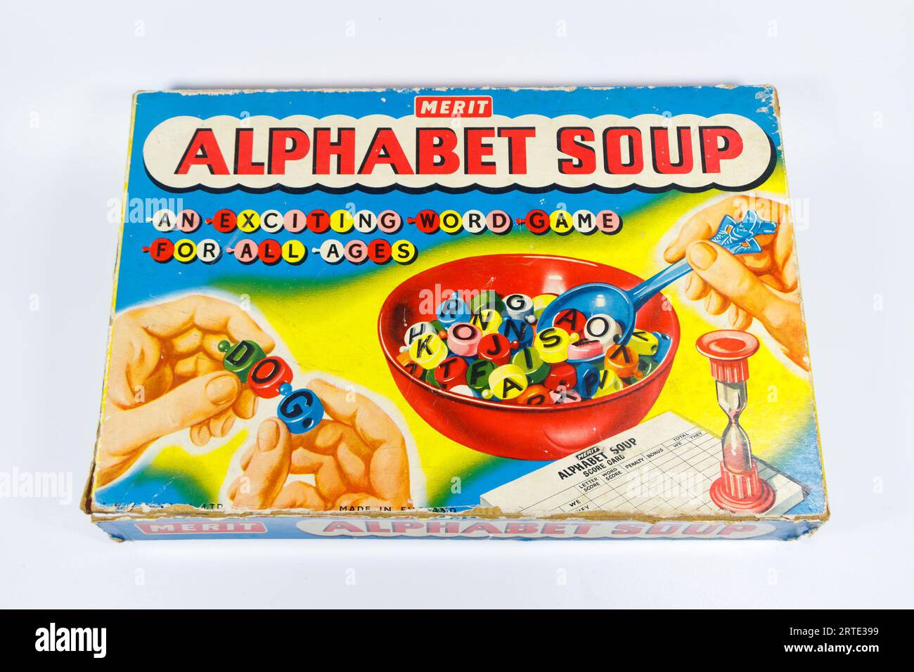 vintage alphabet soup childrens spelling game isolated against white studio background by merit toy company, Bowl, Spoon, Letters, Timer and Score Pad Stock Photo