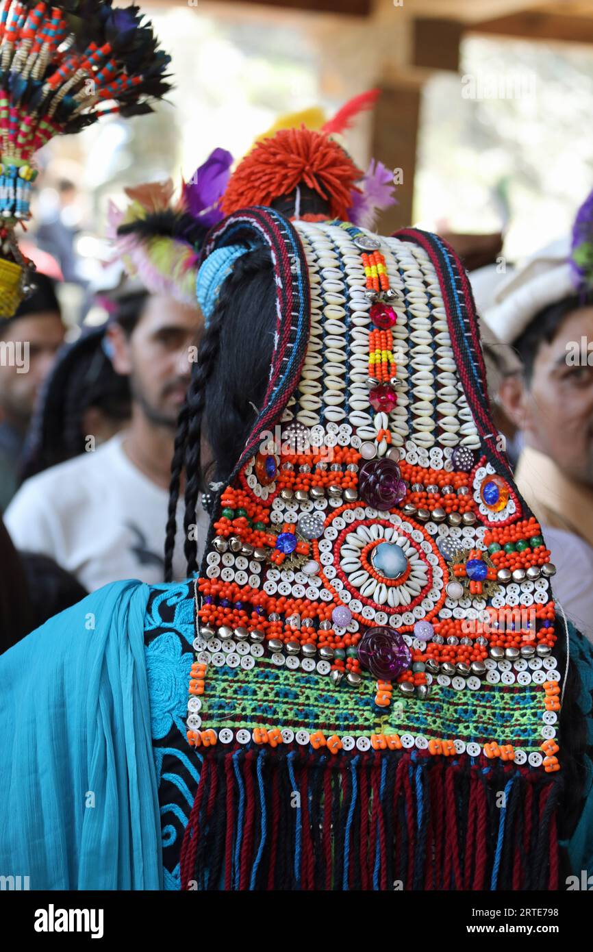 Womans traditional beaded headdress at a celebration in the Kalash Valley Stock Photo