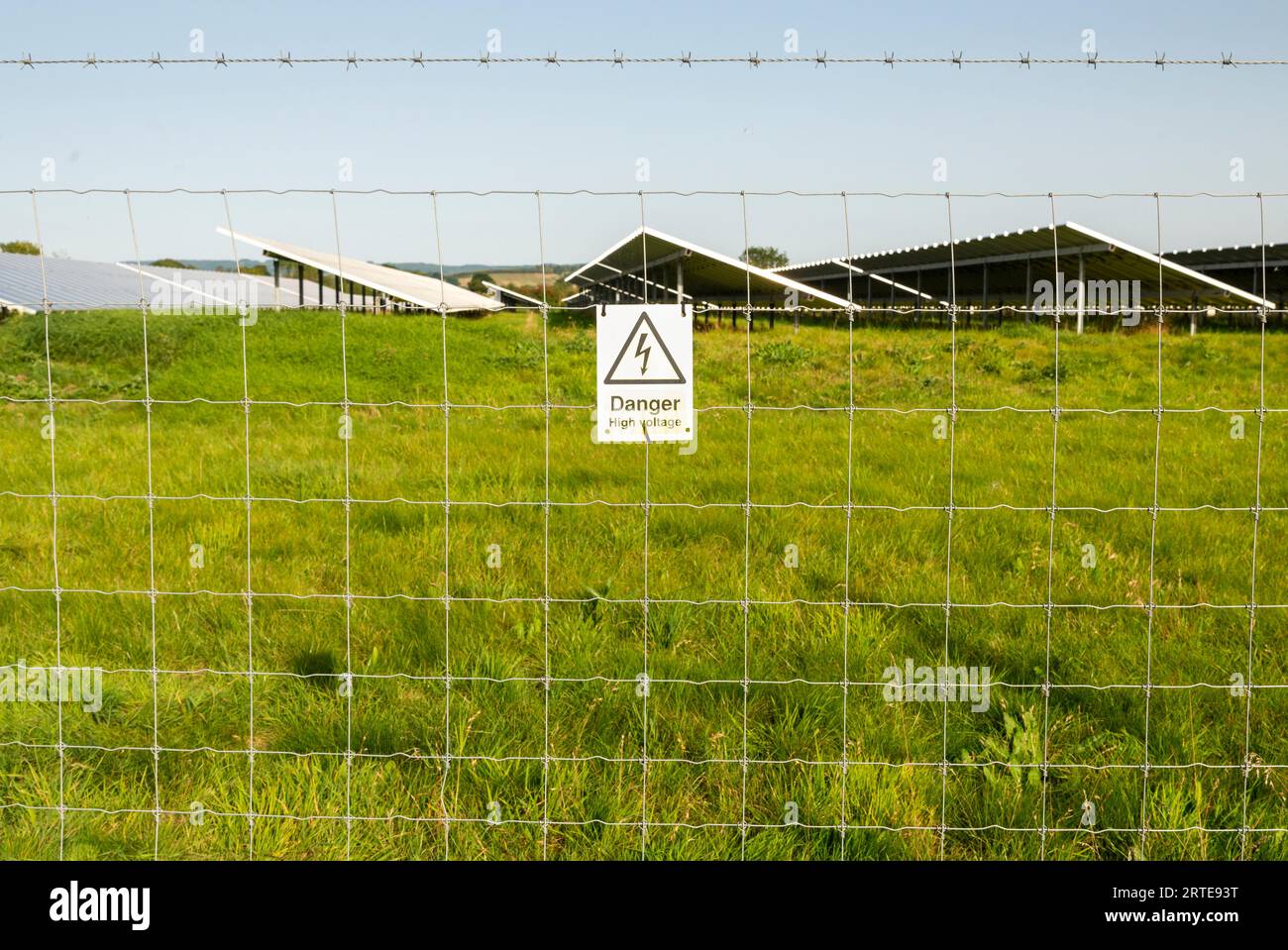 Attached to the barbed wire security fence,surrounding an area of solar panels,at a remote rural locaton in the Cotswolds area of the English countrys Stock Photo