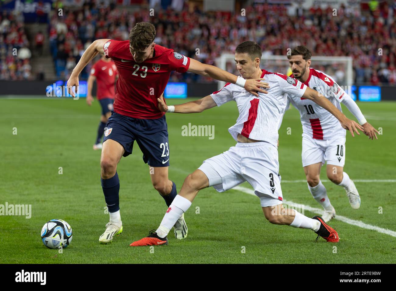 Oslo, Norway 12 September 2023 Luka Gagnidze of Georgia in pursuit of the ball against Jorgen Larsen of Norway during theUEFA European Championship 2024 qualifiers Group A match between Norway and Georgia held at the Ullevaal Stadion in Oslo, Norway credit: Nigel Waldron/Alamy Live News Stock Photo