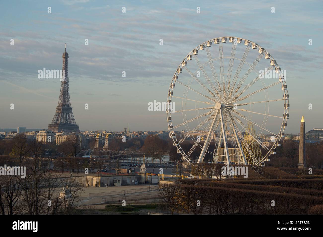 Ferris wheel and the Eiffel Tower adorn the skyline in downtown Paris, France; Paris, France