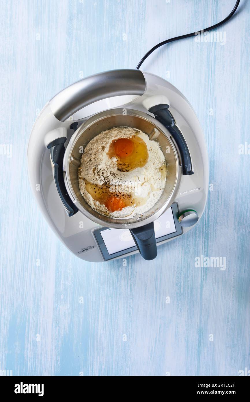 Dough mix for cronuts in the mixer Stock Photo