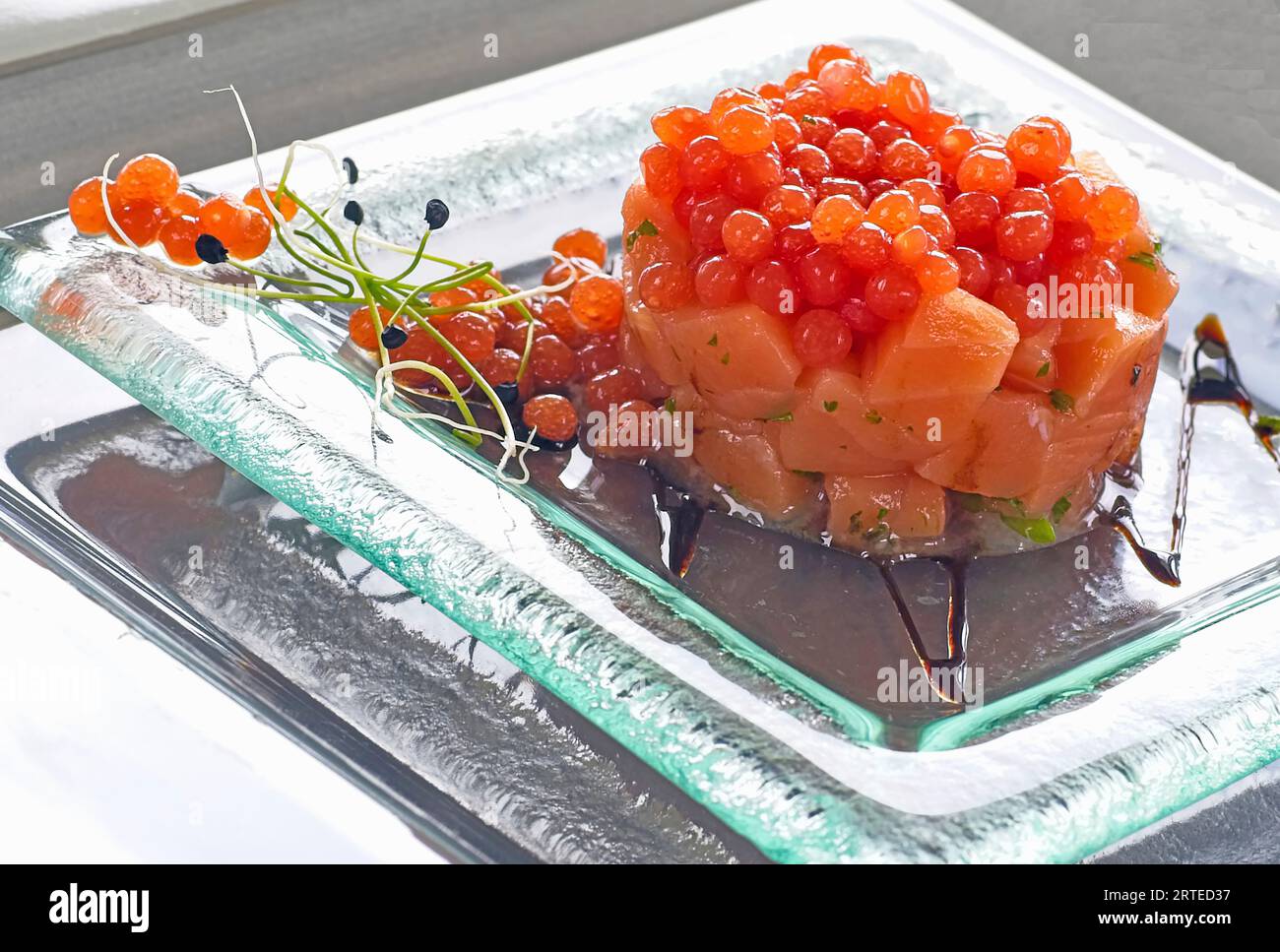 Salmon with ikura caviar Stock Photo