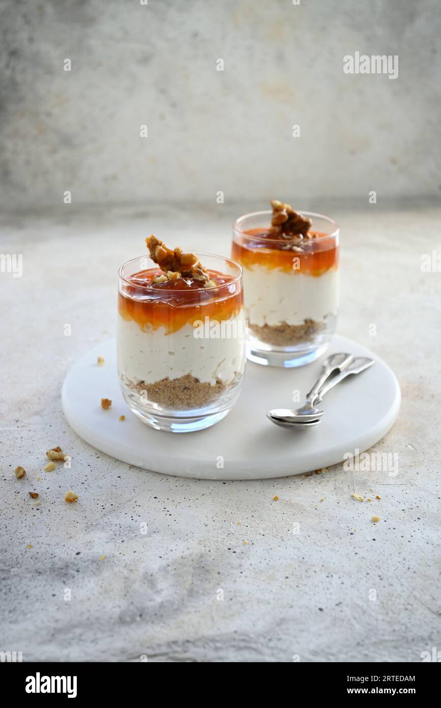 Layered dessert of cookies, whipped cream cheese, apricot jam and