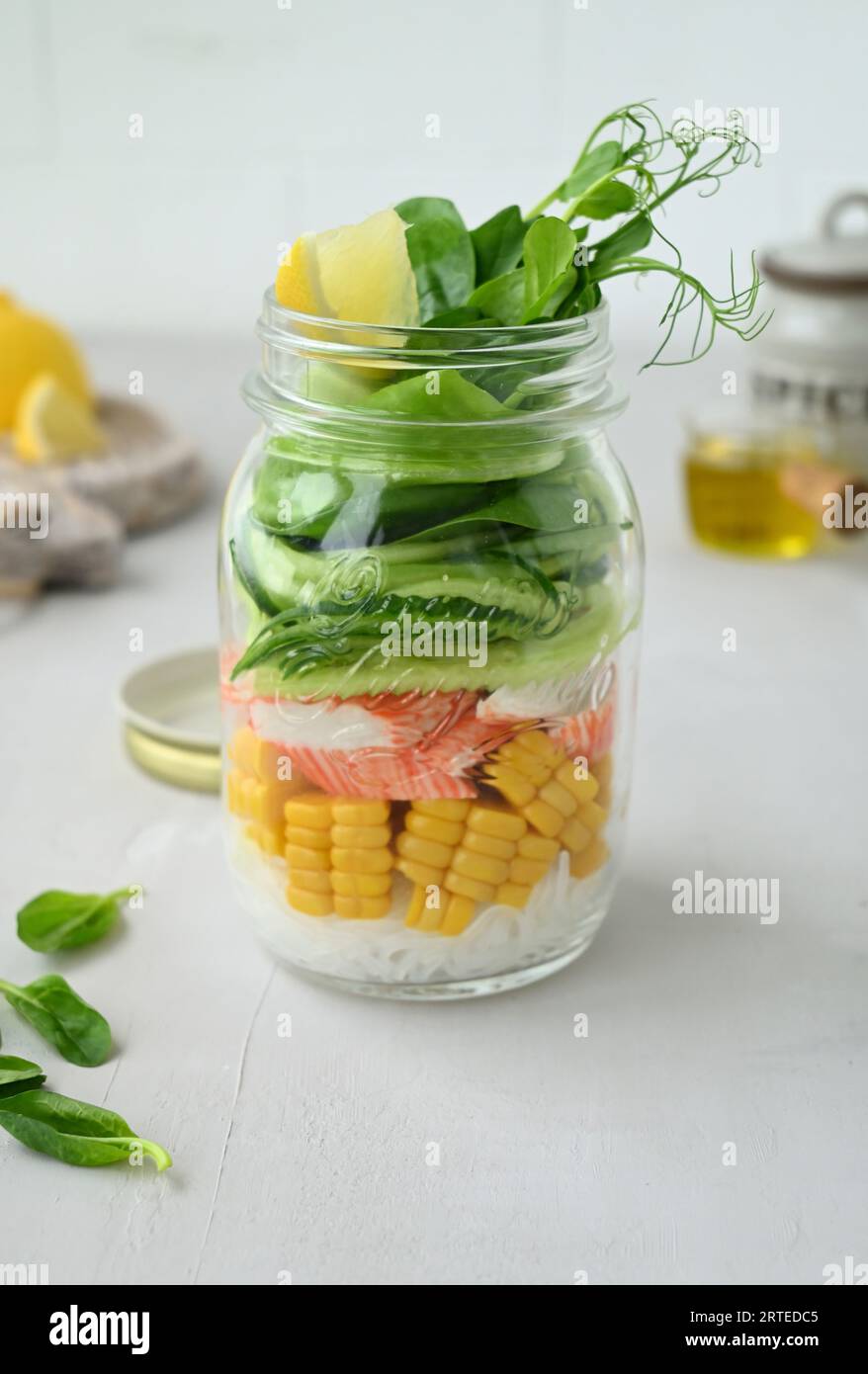 Salad with glass noodles, corn, surimi crab and cucumber Stock Photo
