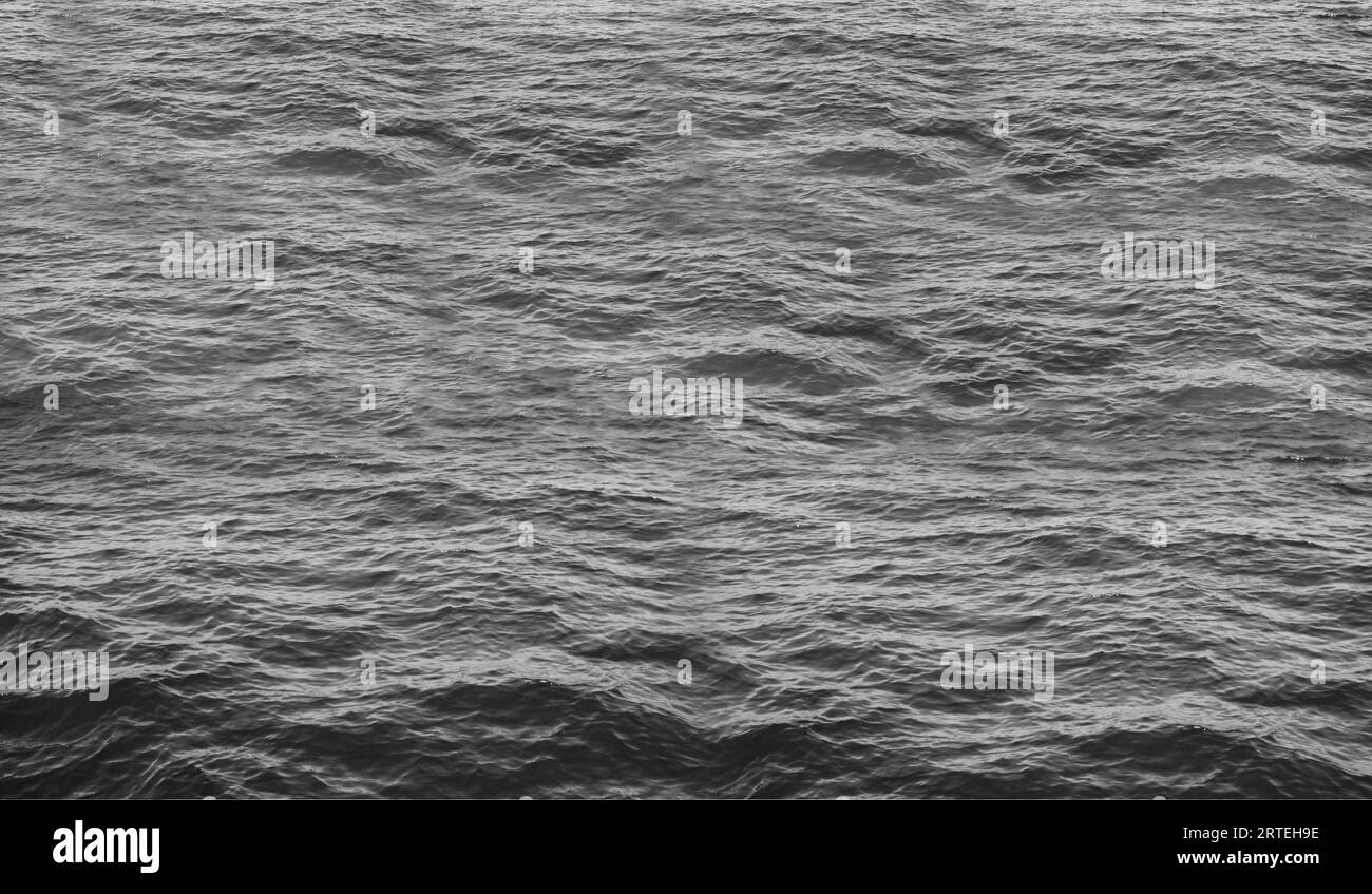 Black and white photo of the surface of the water in the sea Stock ...