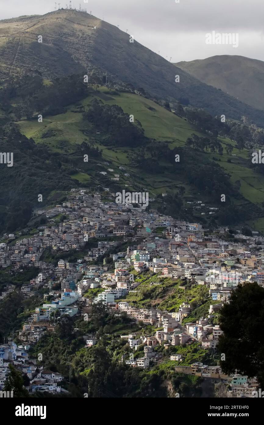 Neighborhoods on the hills surrounding the city of Quito; Quito, Ecuador Stock Photo