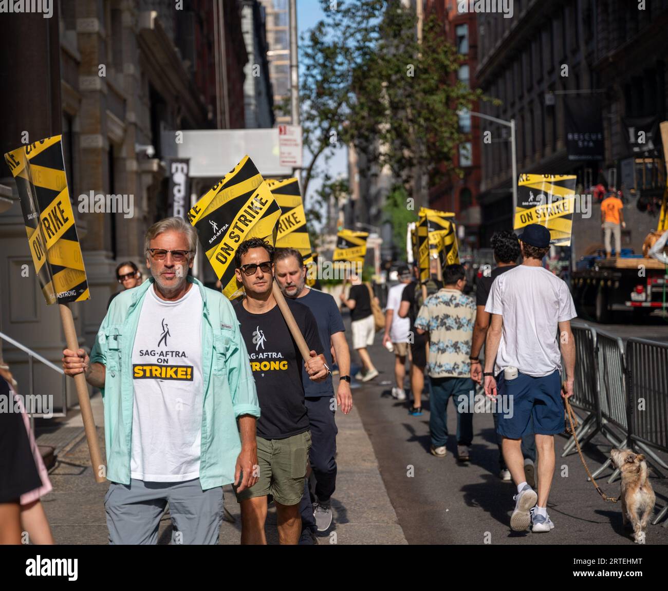 New York, USA. 12th Sep, 2023. Members of the SAG-AFTRA union, which represents actors and other performers, gather with supporters to picket outside of the offices of Warner Bros. Discovery and Netflix as part of an ongoing labor strike in New York, NY on September 12, 2023. The strike commenced on July 14, 2023 after union negotiations with film studios and streaming services, negotiating together as the Alliance of Motion Picture and Television Producers (AMPTP), broke down. (Photo by Matthew Rodier/Sipa USA) Credit: Sipa USA/Alamy Live News Stock Photo