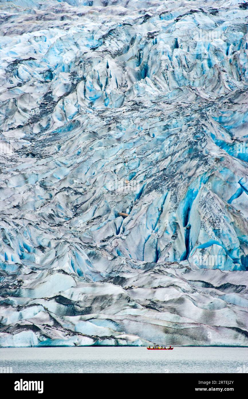 Tour boat floats past the Mendenhall Glacier; Juneau, Alaska, United States of America Stock Photo