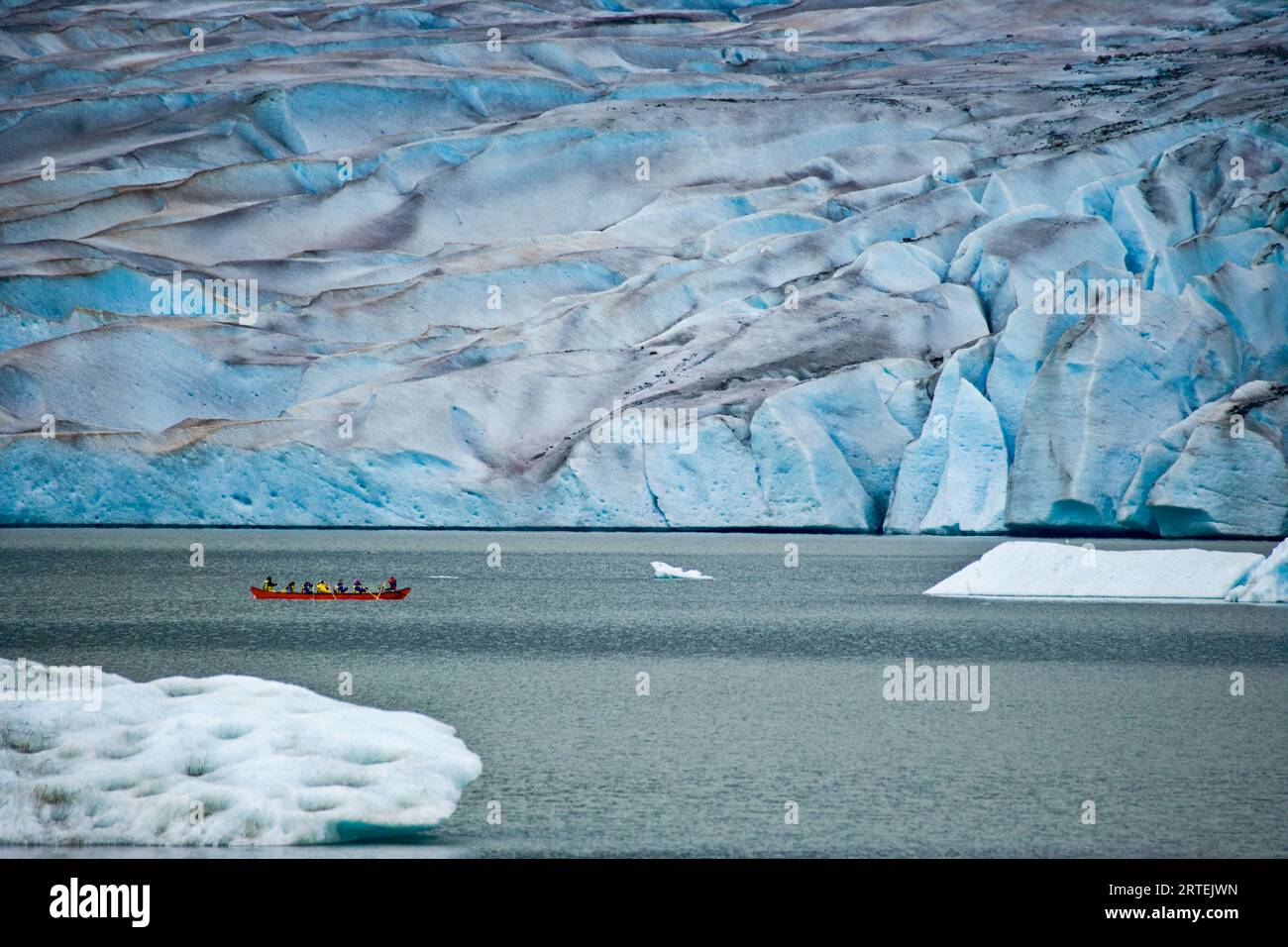 Boat rows along the Mendenhall Glacier; Juneau, Alaska, United States of America Stock Photo