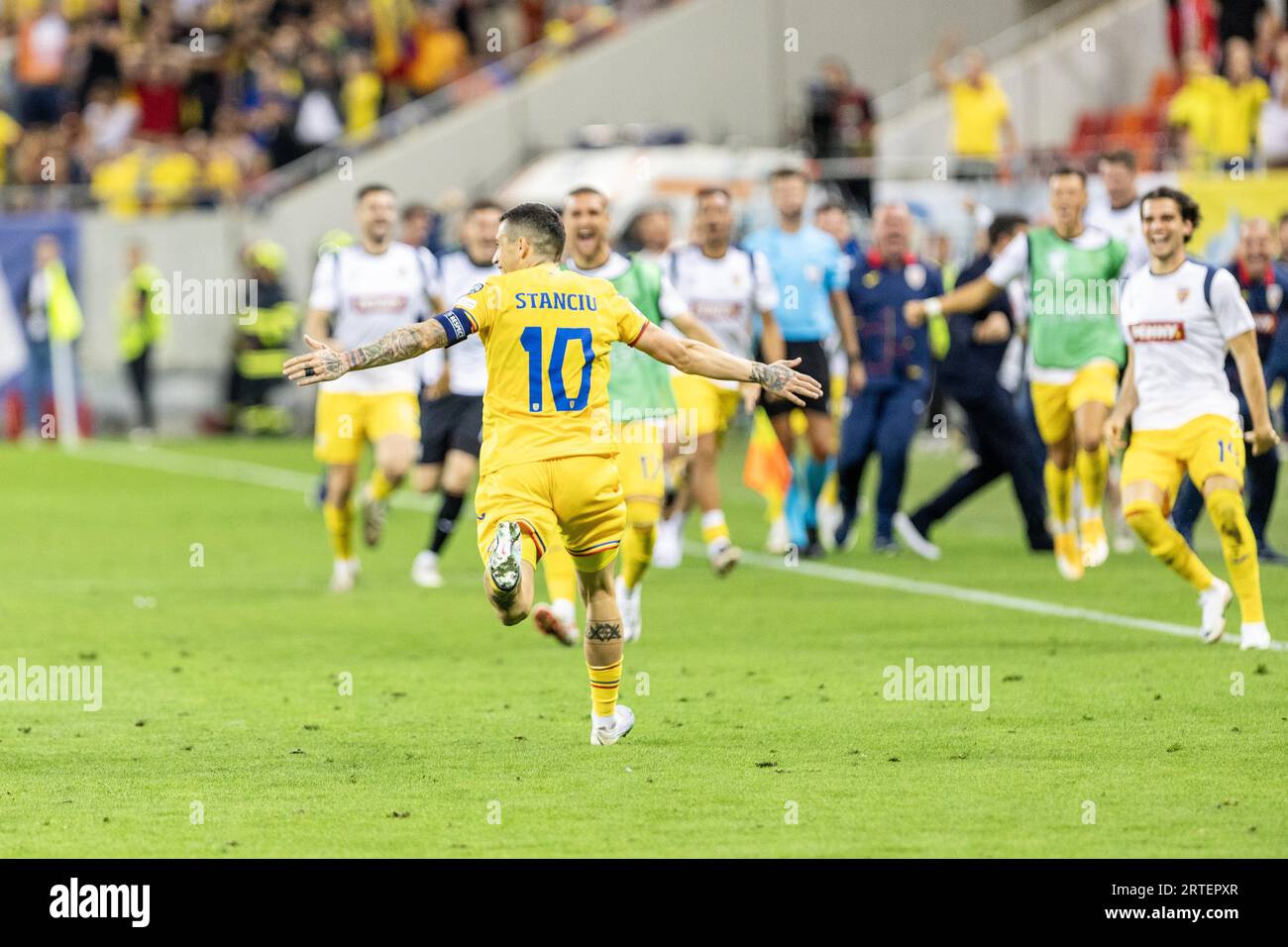 Nicolae Stanciu of Romania celebrates scoring his team's first goal to