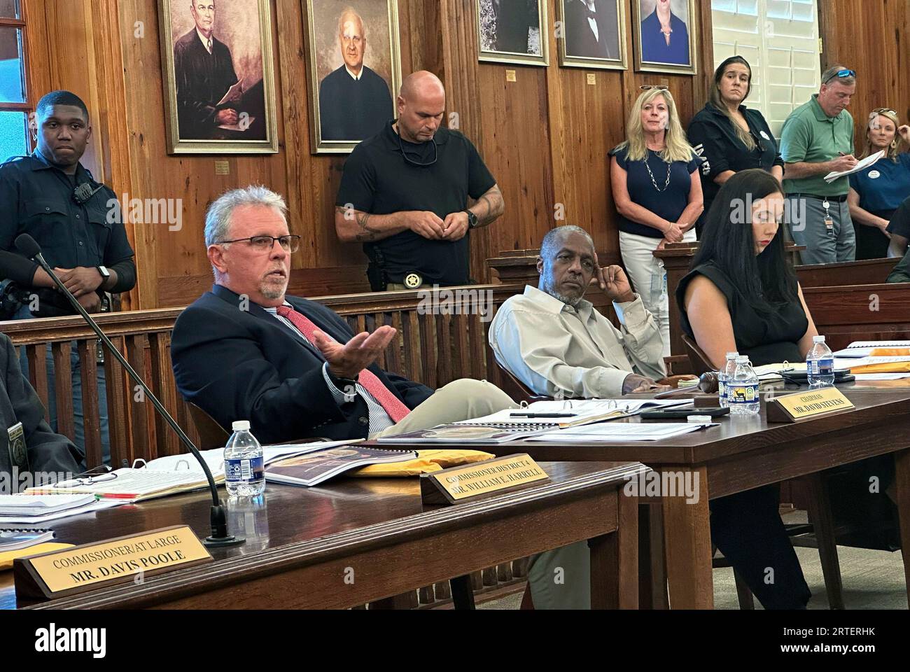 McIntosh County Commission Chairman David Stevens, left, speaks Tuesday
