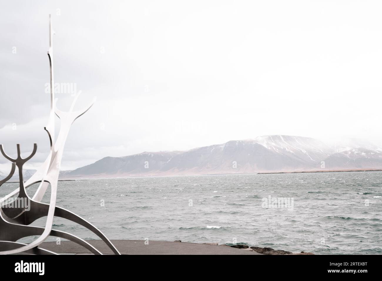Iconic 'Sun Voyager' sculpture in Reykjavik: a gleaming ship of dreams against the sea's endless horizon. Stock Photo
