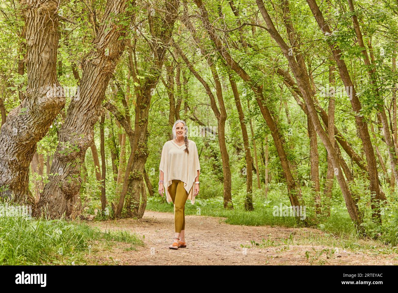 Woman walking in public park hi-res stock photography and images - Alamy