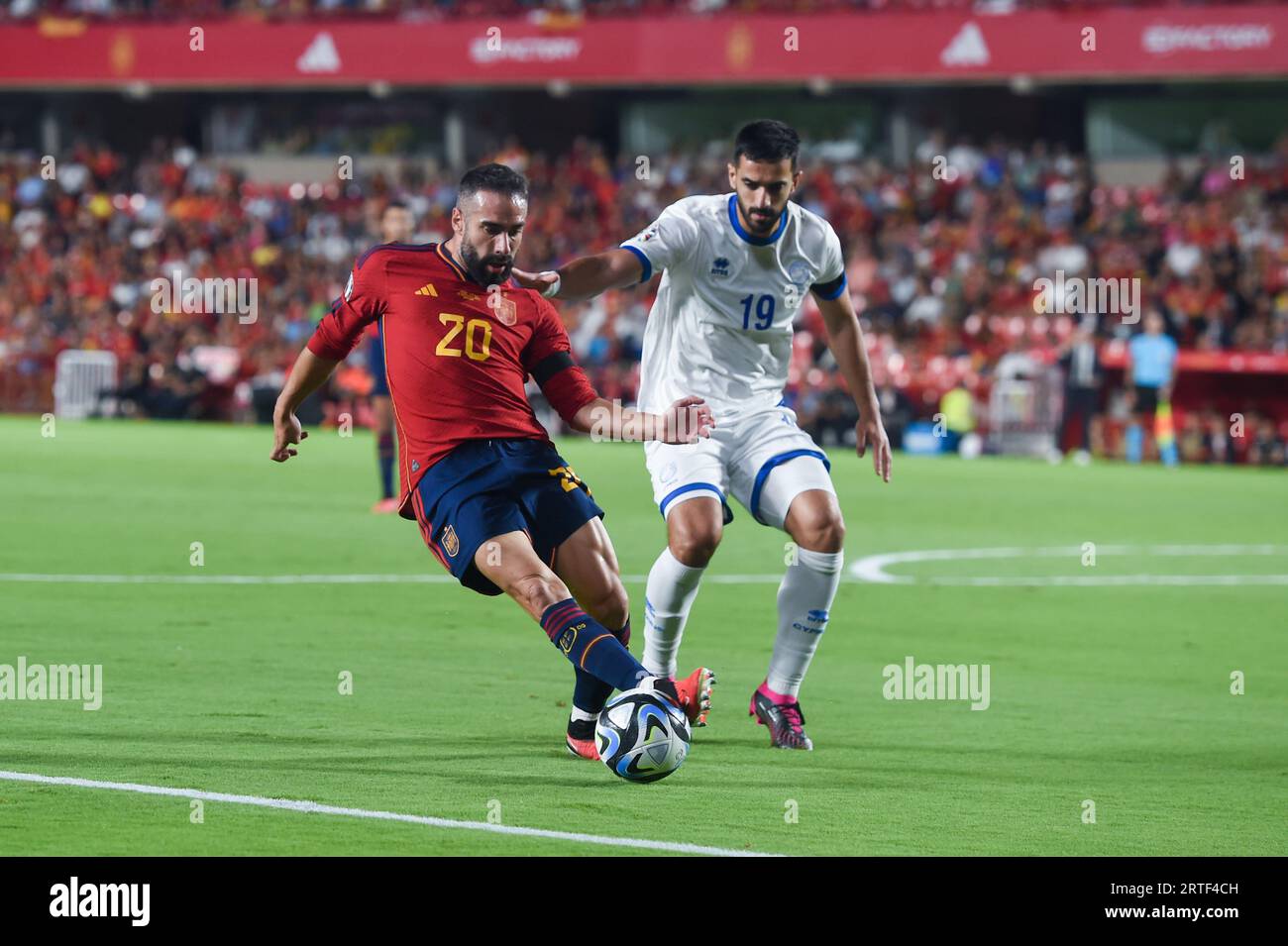 Granada, Spain. 12th Sep, 2023. Dani Carvajal (L) of Spain vies with Konstantinos Laifis of Cyprus during the UEFA European Championship 2024 Qualifying group round match between Spain and Cyprus in Granada, Spain, on Sept. 12, 2023. Credit: Gustavo Valient/Xinhua/Alamy Live News Stock Photo