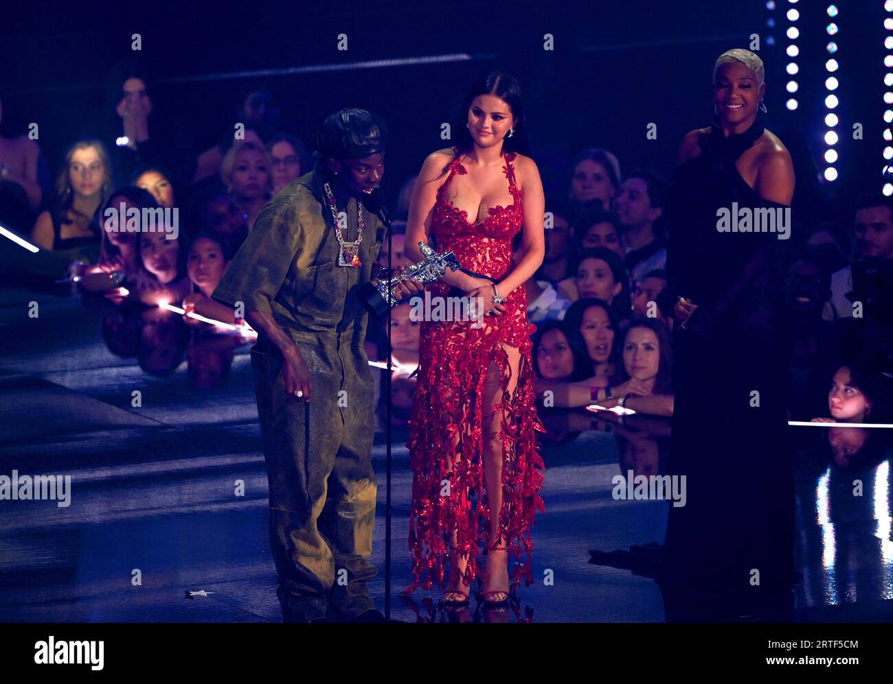 Rema and Selena Gomez on stage after winning the Best Afrobeats award