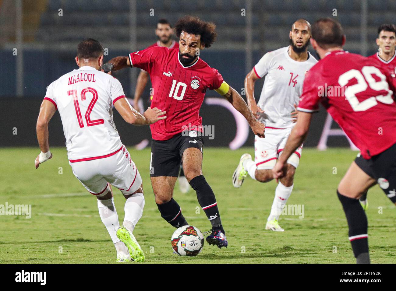 Cairo, Egypt. 12th Sep, 2023. Mohamed Salah (2nd L) of Egypt vies with Ali Maaloul (1st L) of Tunisia during the international friendly match between Egypt and Tunisia in Cairo, Egypt, Sept. 12, 2023. Credit: Ahmed Gomaa/Xinhua/Alamy Live News Stock Photo