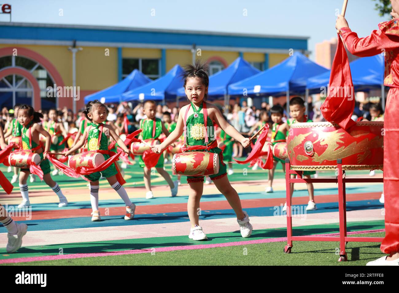 Luannan County - May 31, 2019: Children waist drum performance to celebrate International Children's Day, Luannan County, Hebei Province, China Stock Photo