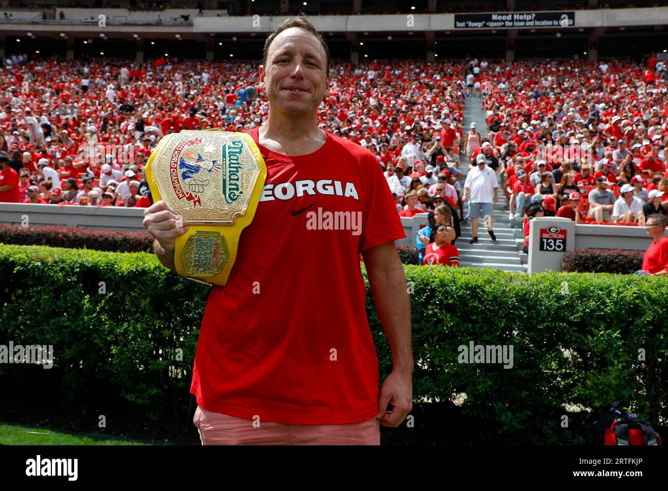 Competitive eater Joey Chestnut poses for a photo during a college football regular season game between the Ball State Cardinals and the Georgia Bulld Stock Photo