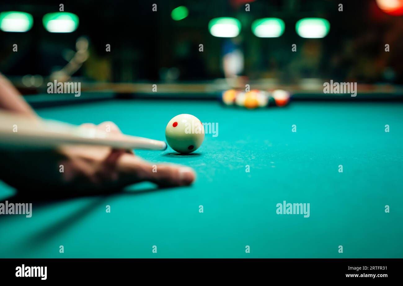 Preparing to break spheres into the pool pocket. People billiard ...