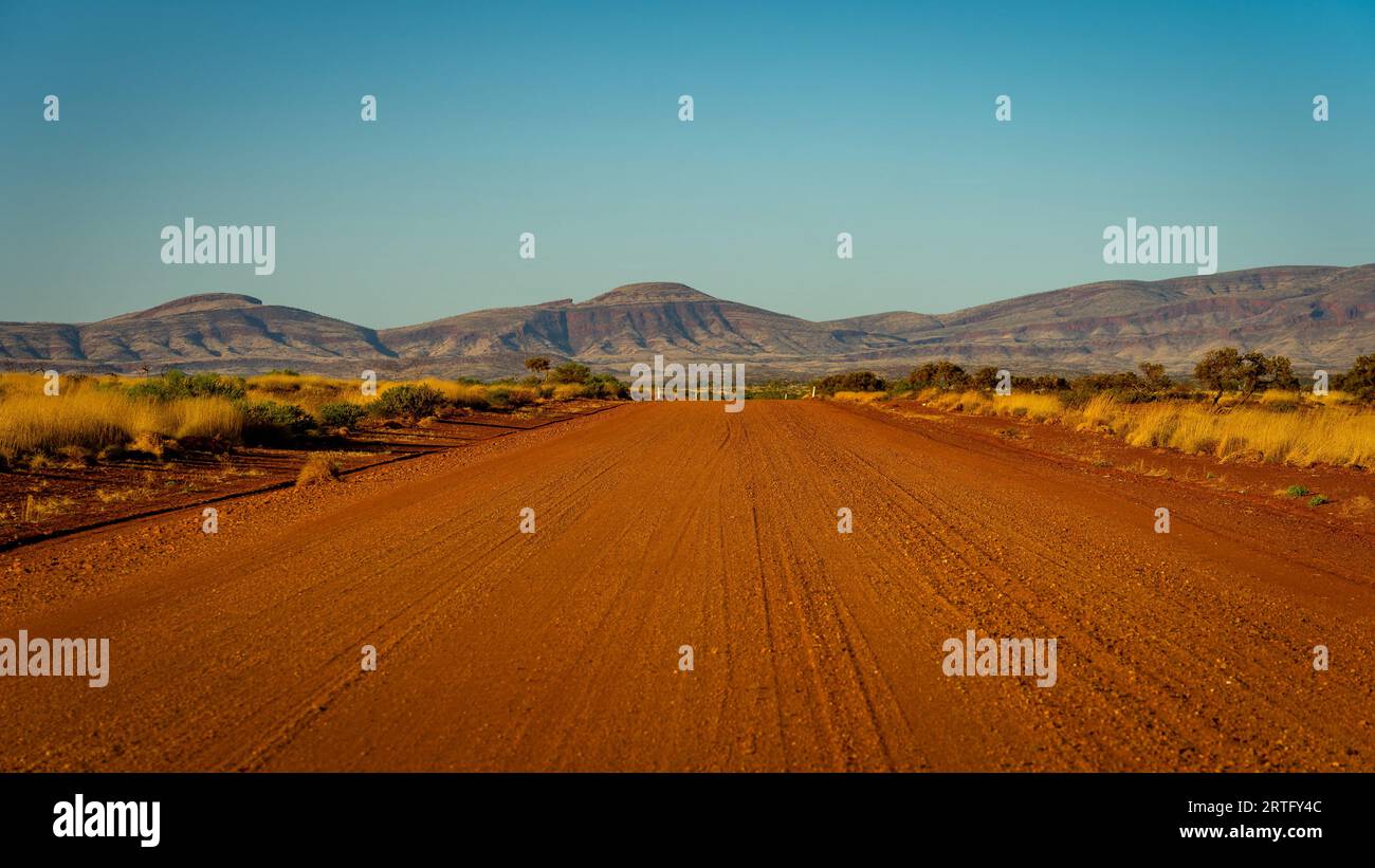 Unsealed Nanutarra-Munjina dirt road in rural WA, Australia Stock Photo