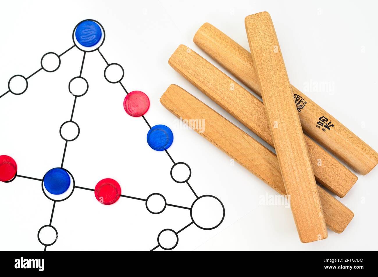 Yut is a traditional Korean board game that uses four wooden sticks