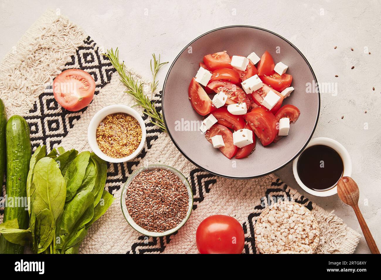 Vegan fresh ingredients for healthy low fodmap, Mediterranean diet with vegetables, fruits, greens, salad with feta. Flat lay, copy space. Stock Photo