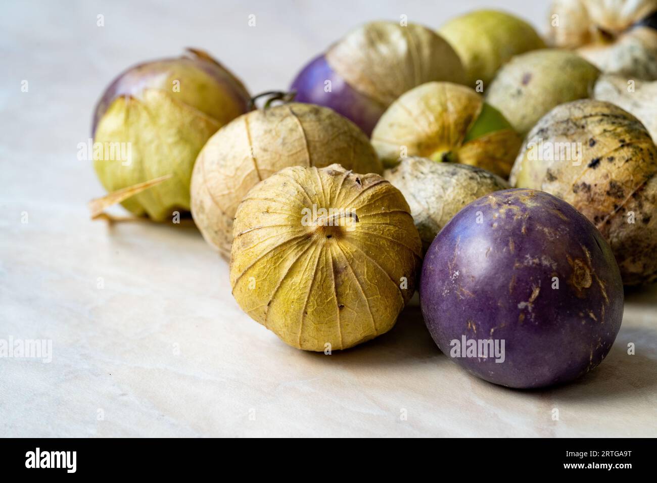 Tomatillos, green tomatoes, with salsa verde, green sauce, in a