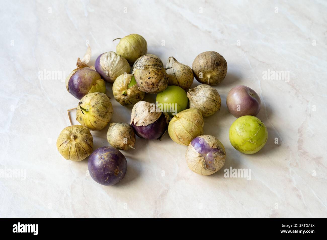 Tomatillos, green tomatoes, with salsa verde, green sauce, in a
